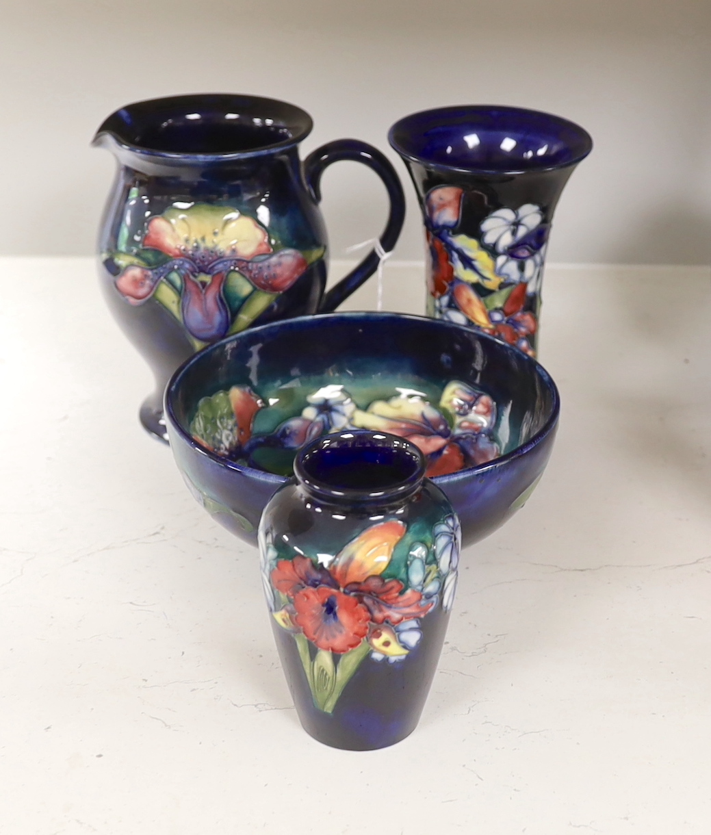 Four pieces of Moorcroft pottery, tallest 15cm